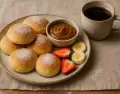Pan de leche casero, esponjoso y suave, ideal para el desayuno o la merienda.