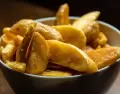 Papas al horno doradas y crocantes con sabrosos condimentos arom�ticos.